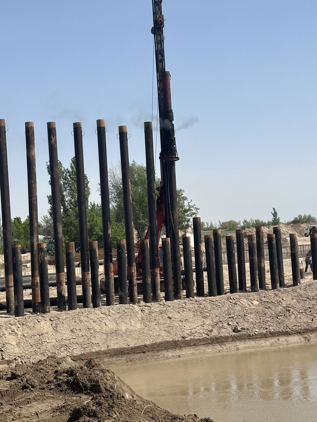 Steel piles installed along canal