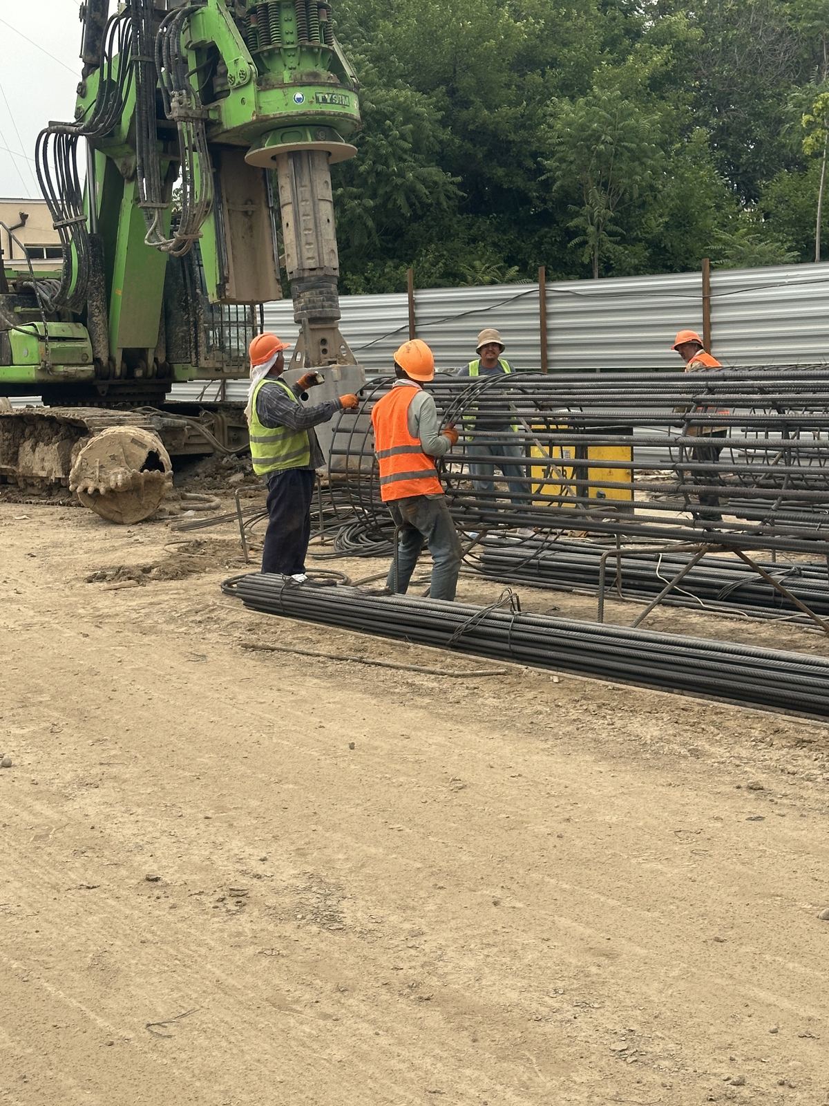 Crew assembling rebar cage
